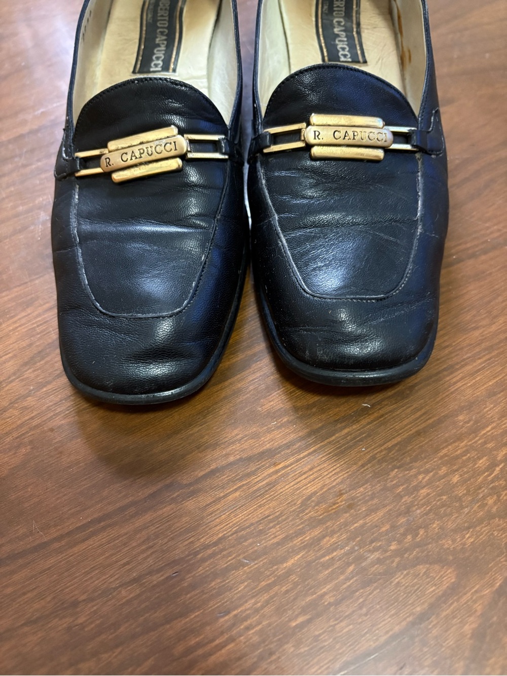 Black Leather Slip-On Loafers with Gold Accent